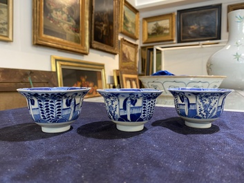 A Chinese blue and white vase and three cups and saucers, Kangxi and later