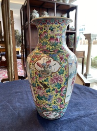 A Chinese famille rose yellow ground vase with warrior and palace scenes and floral design, 19th C.