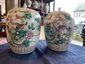 A pair of Chinese famille rose jars and covers with phoenixes among blossoming branches, 19th C.