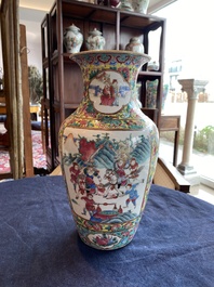 A Chinese famille rose yellow ground vase with warrior and palace scenes and floral design, 19th C.