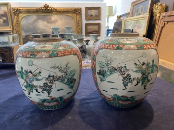 A pair of Chinese famille verte jars with lotus scrolls and figures in a landscape, 19th C.