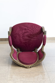 A French Louis XVI style gilt wood armchair with red fabric upholstery, 19th/20th C.
