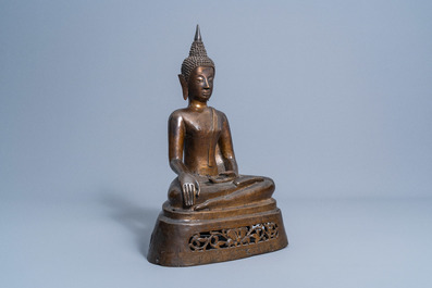 A Thai patinated bronze figure of a seated Buddha, 19th C.
