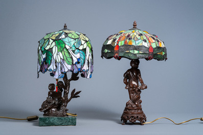 Two Tiffany style 'dragonfly' and 'flower' lamps with glass shades, 20th C.