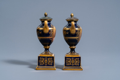 A pair of Vienna gold layered blue ground vases and covers with the portraits of 'Madame de Montosson' and 'Madame Elisabeth', 19th/20th C.