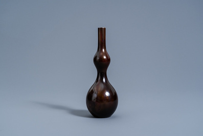 A Japanese bronze double gourd vase with flamed brown patina, Yoshida Kazumas, Showa, 20th C.