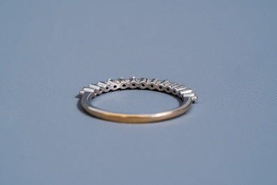 An 18 carat white gold ring set with thirteen diamonds, 20th C.
