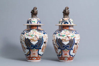 A pair of French Samson Imari style vases and covers with birds among flower branches and figures, 19th C.