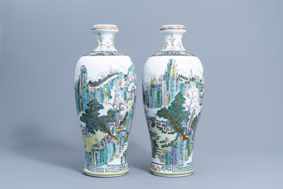 A pair of Chinese famille verte meiping vases with an animated landscape all around, 20th C.