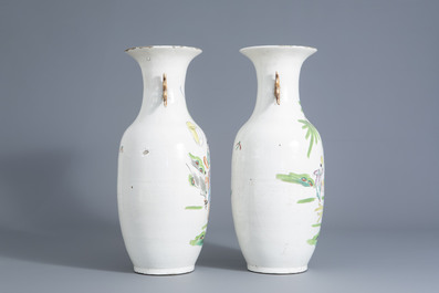 A pair of Chinese qianjiang cai vases with figures in a garden, 20th C.