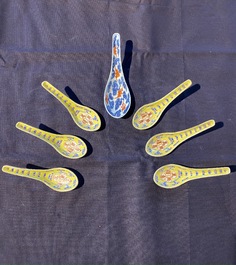 Six Chinese famille rose yellow-ground spoons and a blue, white and iron red 'bats' spoon, 19th/20th C.