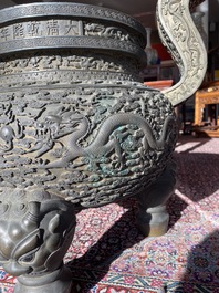 An impressive Chinese bronze 'dragons chasing the pearl' incense burner, Qianlong mark and of the period