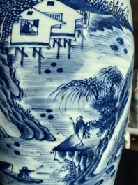 Two Chinese blue and white vases with a phoenix among blossoming branches and an animated landscape, 19th C.