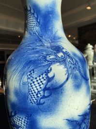 A Chinese blue and white 'dragons chasing the pearl' vase, 19th C.