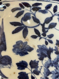 A Chinese blue and white vase with birds among blossoming branches, 19th C.