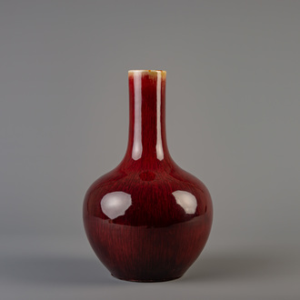 A Chinese sang de boeuf glazed tianqiu ping bottle vase, Kangxi mark, 19th C.