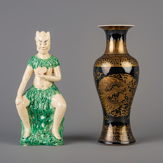 A Chinese monochrome black gilt decorated vase and a Shiwan figure, 19th C.