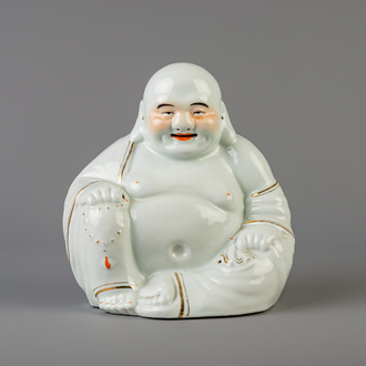 A large Chinese white, iron red and gilt porcelain figure of Buddha, 19th/20th C.
