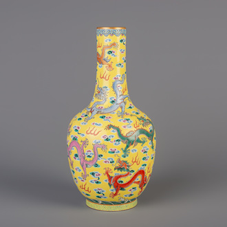 A Chinese famille rose yellow ground vase with dragons chasing the pearl, Daoguang mark, 19th/20th C.