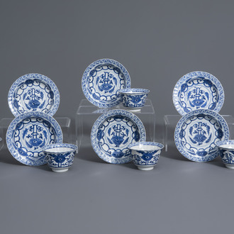 Six Chinese blue and white cups and saucers with floral design, Kangxi mark, 19th C.