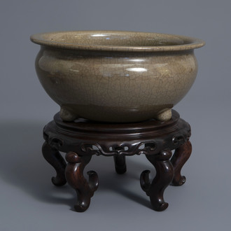 A Chinese crackle glazed tripod incense burner on stand, 19th/20th C.