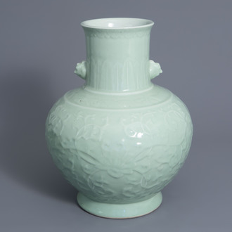 A large Chinese monochrome celadon floral relief decorated vase, Qianlong mark, 19th/20th C.