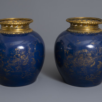 A pair of ormolu mounted Chinese gilt decorated powder blue ground jars, 19th/20th C.