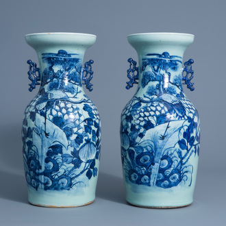 A pair of Chinese blue and white celadon vases with cranes on a rock, 19th C.