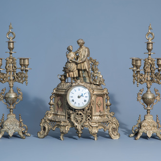 A French three-piece gilt metal romantic clock garniture, 19th/20th C.