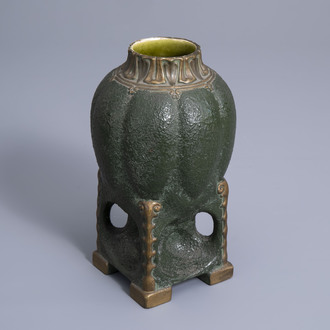 A green patinated and gilt Vienna Secession vase on four feet, Austria, first quarter of the 20th C.