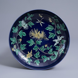 A Chinese dark blue ground 'chrysanthemum' dish, Kangxi mark, 19th/20th C.