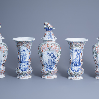 A large Dutch Delft polychrome five-piece garniture with floral design and figures in a landscape, 19th C.