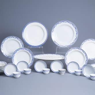 A collection of blue and white Tournai porcelain plates, cups and saucers and a strainer, 19th C.