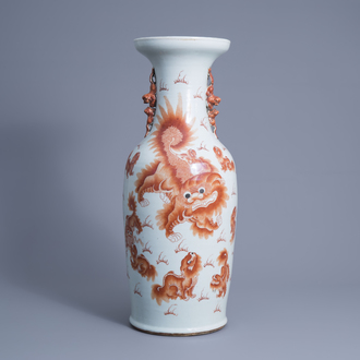 A Chinese iron red vase with Buddhist lions, 19th C.