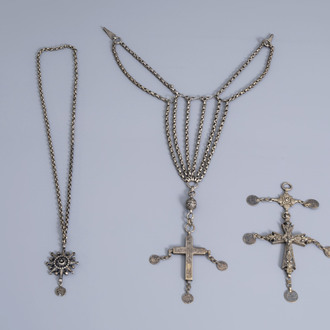 A varied collection of partly silver religious necklaces and crosses, various origins, 19th/20th C.