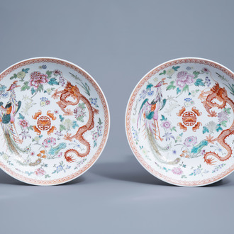 A pair of Chinese famille rose 'dragon and phoenix' chargers, Qianlong mark, 20th C.