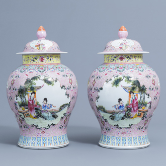 A pair of Chinese famille rose vases and covers with ladies playing music and reading, Qianlong mark, 20th C.