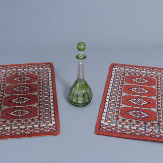 A partly green overlay crystal cut decanter and a pair of Oriental carpets, 20th C.