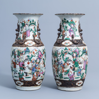 A pair of Chinese Nanking crackle glazed famille rose 'warrior' vases, 19th/20th C.