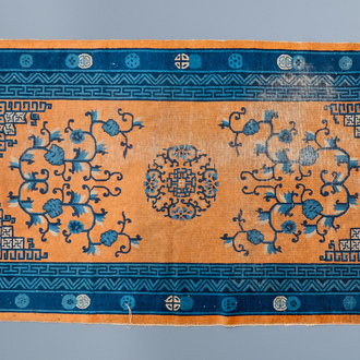 A large Chinese rectangular carpet, 19th C.