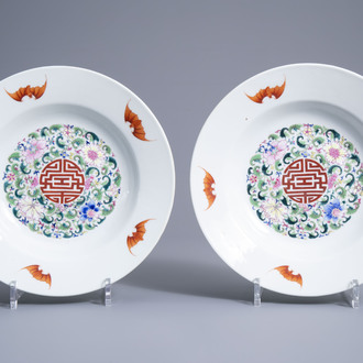 A pair of Chinese famille rose 'bats and Shou' dishes with lime green ground backs, Qianlong mark, 20th C.