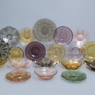 A large and varied collection of Art Deco coloured glass chargers and bowls, 20th C.