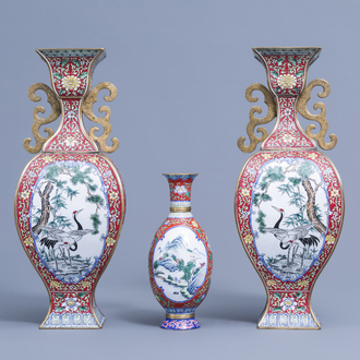 A pair of Chinese baluster shaped Canton enamel vases with various birds among blossoming branches and a vase with a landscape, 20th C.