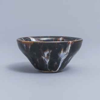 A Chinese black and white splashed Song style bowl, 20th C.