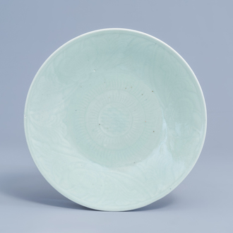 A Chinese celadon plate with floral anhua design, 19th C.