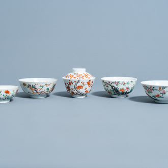 Four various Chinese famille rose bowls and one bowl and cover with floral design, 19th/20th C.