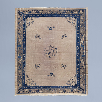 A Chinese 'Peking' rug with floral design, wool on cotton, first half of the 20th C.