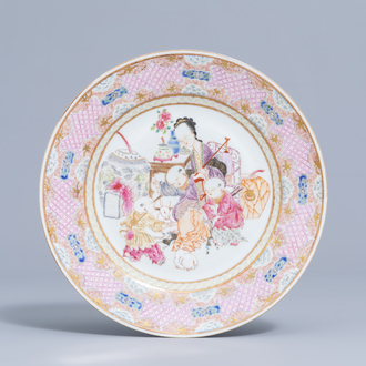 A Chinese famille rose Yongzheng style plate with figures and rabbits in an interior, 19th/20th C.