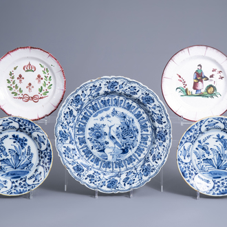 Two Dutch Delft blue and white plates and a charger and two French faience de l'Est plates, 18th/19th C.