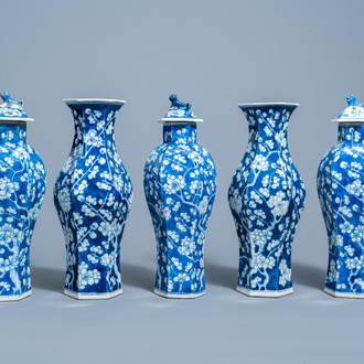 A Chinese blue and white prunus on cracked ice ground five-piece garniture, 19th C.